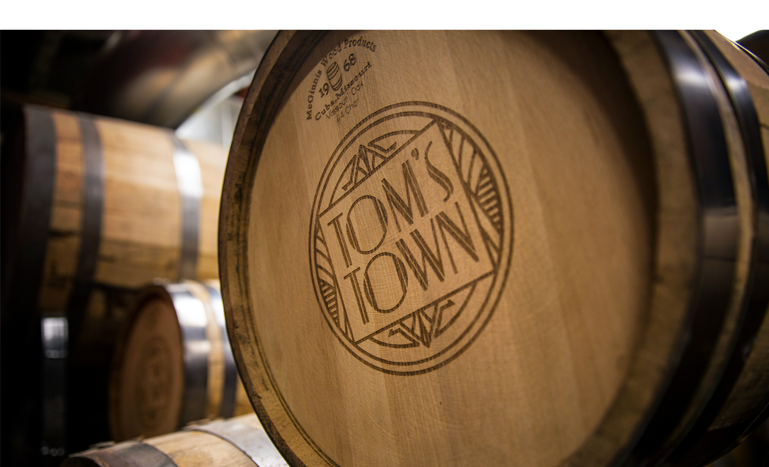 Tom's Town Distilling Co: Spirits Branding Logo on barrel